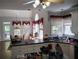 Bright kitchen featuring an island, double sink, and an adjacent breakfast nook with backyard views at 1470 Sweet Bottom Sw Cir, Marietta, GA 30064