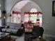 Comfortable living room with an archway to the dining area featuring large windows at 1470 Sweet Bottom Sw Cir, Marietta, GA 30064