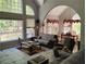 Bright living room with large windows, an archway, and a view of the outdoor space at 1470 Sweet Bottom Sw Cir, Marietta, GA 30064