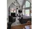 Open concept living room with fireplace, entertainment center, and abundant natural light at 1470 Sweet Bottom Sw Cir, Marietta, GA 30064