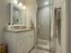 Well-lit bathroom with modern vanity and a glass-enclosed shower at 1894 Dogwood Ct, Snellville, GA 30078