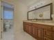 Bathroom featuring double sinks, granite countertops and tile flooring at 1894 Dogwood Ct, Snellville, GA 30078