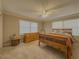 Cozy bedroom featuring neutral tones, two windows and a light colored carpet at 1894 Dogwood Ct, Snellville, GA 30078