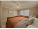 Bedroom featuring a plush bed, white closet door, and two windows at 1894 Dogwood Ct, Snellville, GA 30078