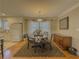 Charming dining area featuring hardwood floors, modern light fixture, and decorative accents at 1894 Dogwood Ct, Snellville, GA 30078