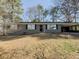 Inviting single-story home featuring a covered carport and well-maintained front lawn at 1894 Dogwood Ct, Snellville, GA 30078