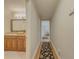 Hallway leading to bathroom and living areas with hardwood floors and neutral decor at 1894 Dogwood Ct, Snellville, GA 30078
