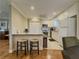 Efficient kitchen with white cabinets, a breakfast bar, and stainless steel appliances at 1894 Dogwood Ct, Snellville, GA 30078