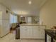 Bright eat-in kitchen area with marble countertops and white cabinetry offering ample storage space at 1894 Dogwood Ct, Snellville, GA 30078