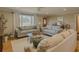 Comfortable living room with large windows, stylish decor, and a ceiling fan at 1894 Dogwood Ct, Snellville, GA 30078