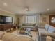 Cozy living room with plush seating, a ceiling fan, and hardwood floors at 1894 Dogwood Ct, Snellville, GA 30078