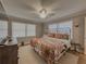 Inviting main bedroom with natural light, fan, and plush carpet at 1894 Dogwood Ct, Snellville, GA 30078