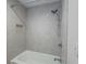 Tiled shower with built-in niche and adjustable shower head at 1894 Dogwood Ct, Snellville, GA 30078
