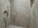 Tiled stand up shower with gray stone-style finishings at 1894 Dogwood Ct, Snellville, GA 30078