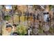 Aerial view showing lot lines of property including the house and wooded acreage at 3192 Highway 411 Ne, White, GA 30184