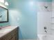 A well-lit bathroom featuring a vanity with a vessel sink and a bathtub with a shower at 3192 Highway 411 Ne, White, GA 30184