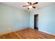 Bedroom featuring hardwood floors, a ceiling fan, and an entrance to a closet at 3192 Highway 411 Ne, White, GA 30184