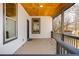Inviting front porch with gray railings, offering a welcoming entrance at 3192 Highway 411 Ne, White, GA 30184