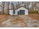 A detached garage or workshop with roll up door and two entry doors at 3192 Highway 411 Ne, White, GA 30184