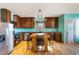 Well-appointed kitchen featuring custom wood cabinets, stainless steel appliances, and eat in dining at 3192 Highway 411 Ne, White, GA 30184