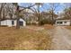 Property with detached garage, workshop, and multiple houses on a long driveway at 3192 Highway 411 Ne, White, GA 30184