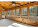 Enclosed sun room with ceiling fans, natural lighting and tranquil wooded views at 3192 Highway 411 Ne, White, GA 30184