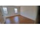 Well-lit bedroom featuring hardwood floors, natural lighting, and scenic views at 3307 York Pl, Decatur, GA 30032