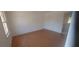 A room featuring hardwood floors and a window overlooking the outdoors at 3307 York Pl, Decatur, GA 30032