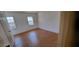 A bedroom features light hardwood floors, natural light, and neutral walls at 3307 York Pl, Decatur, GA 30032