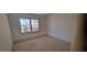 Bright bedroom featuring carpeted floors, natural lighting, and neutral-colored walls at 3307 York Pl, Decatur, GA 30032