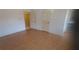 Bedroom featuring hardwood floors, neutral walls, and a connecting door to an ensuite bathroom at 3307 York Pl, Decatur, GA 30032