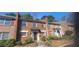 Brick townhome featuring an inviting entrance with mature landscaping and an elegant design at 3307 York Pl, Decatur, GA 30032