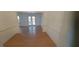 Open-concept living area with views to a patio area through French doors at 3307 York Pl, Decatur, GA 30032
