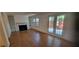 Cozy living room showcases a fireplace, built-in shelving, and access to an outdoor patio at 3307 York Pl, Decatur, GA 30032