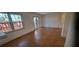 Bright living room featuring hardwood floors and natural light from large windows and French doors at 3307 York Pl, Decatur, GA 30032