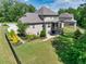Spacious backyard with a well-maintained lawn, lush landscaping, and a fenced perimeter for privacy at 4590 Gablestone Xing, Hoschton, GA 30548