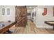 Finished basement with game tables and sliding barn door access to other areas of the home at 4590 Gablestone Xing, Hoschton, GA 30548