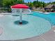 Zero entry community pool with mushroom water feature, seating and steps leading to larger pool at 4590 Gablestone Xing, Hoschton, GA 30548