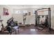 Basement gym features multiple workout machines and equipment for a complete home fitness center at 4590 Gablestone Xing, Hoschton, GA 30548