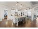 Beautiful kitchen with stainless steel appliances, granite countertops, and a breakfast bar at 4590 Gablestone Xing, Hoschton, GA 30548
