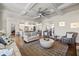 Spacious living room with open access to the kitchen and stylish furnishings at 4590 Gablestone Xing, Hoschton, GA 30548