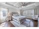 Spacious main bedroom with decorative ceiling and many windows for natural light at 4590 Gablestone Xing, Hoschton, GA 30548