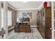 The home office is fitted with beautiful custom built-ins for storage and display at 4590 Gablestone Xing, Hoschton, GA 30548