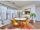 Sunlit dining area with modern chandelier and stylish furnishings at 845 City Park Dr, Mcdonough, GA 30252