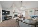 Inviting living room with a stone fireplace, vaulted ceiling, and comfortable seating at 1056 Ferry Creek Way, Acworth, GA 30102