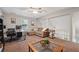 Upstairs living room with a ceiling fan, a sectional couch, and a desk at 1056 Ferry Creek Way, Acworth, GA 30102