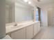 Bathroom featuring a double sink vanity and a large mirror at 2958 Stonecrest Ln, Lithonia, GA 30038