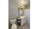 A cozy bathroom featuring stylish wallpaper, vanity with sink, and a shower with curtain at 3478 Grant Nw Dr, Kennesaw, GA 30144