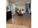 Dining area with white-washed brick wall and hardwood floors at 3478 Grant Nw Dr, Kennesaw, GA 30144