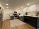 Bright kitchen featuring shaker cabinets, stainless appliances, and a movable island at 3478 Grant Nw Dr, Kennesaw, GA 30144